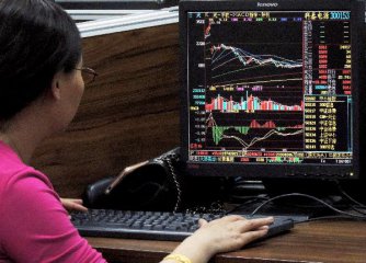 Chinese shares open tad lower on Tue.