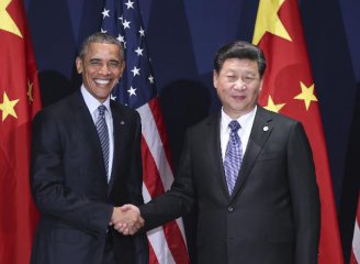  Xi, Obama meet in Paris, pledging cooperation on ties, climate change