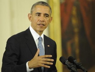 Obama signs temporary funding bill to avert government shutdown