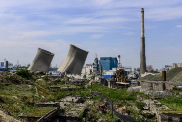 Xinjiang city razes chimneys for clean air