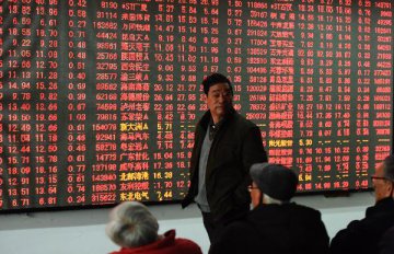 Chinese shares close higher Friday