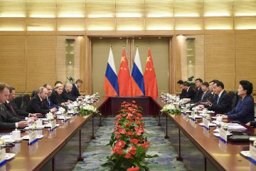 China, Russia ink 30-plus cooperation deals