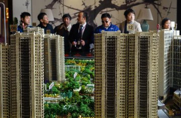 Xinhua Insight: China city moves to dampen hot housing market