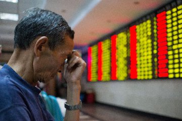 Chinese shares close lower at midday