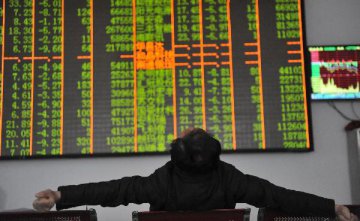 Chinese shares close lower at midday Monday