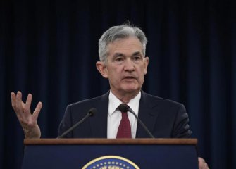 U.S. Fed raises rates, but signals slower pace of hikes next year