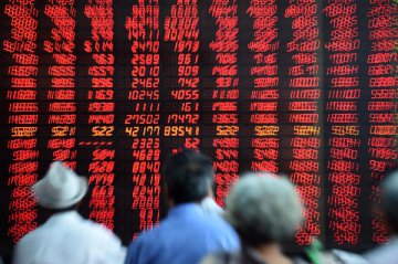 Chinese shares close higher at midday Monday