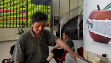 Chinese shares close lower at midday Tuesday