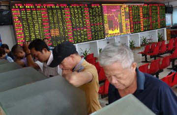 Chinese shares open lower Monday