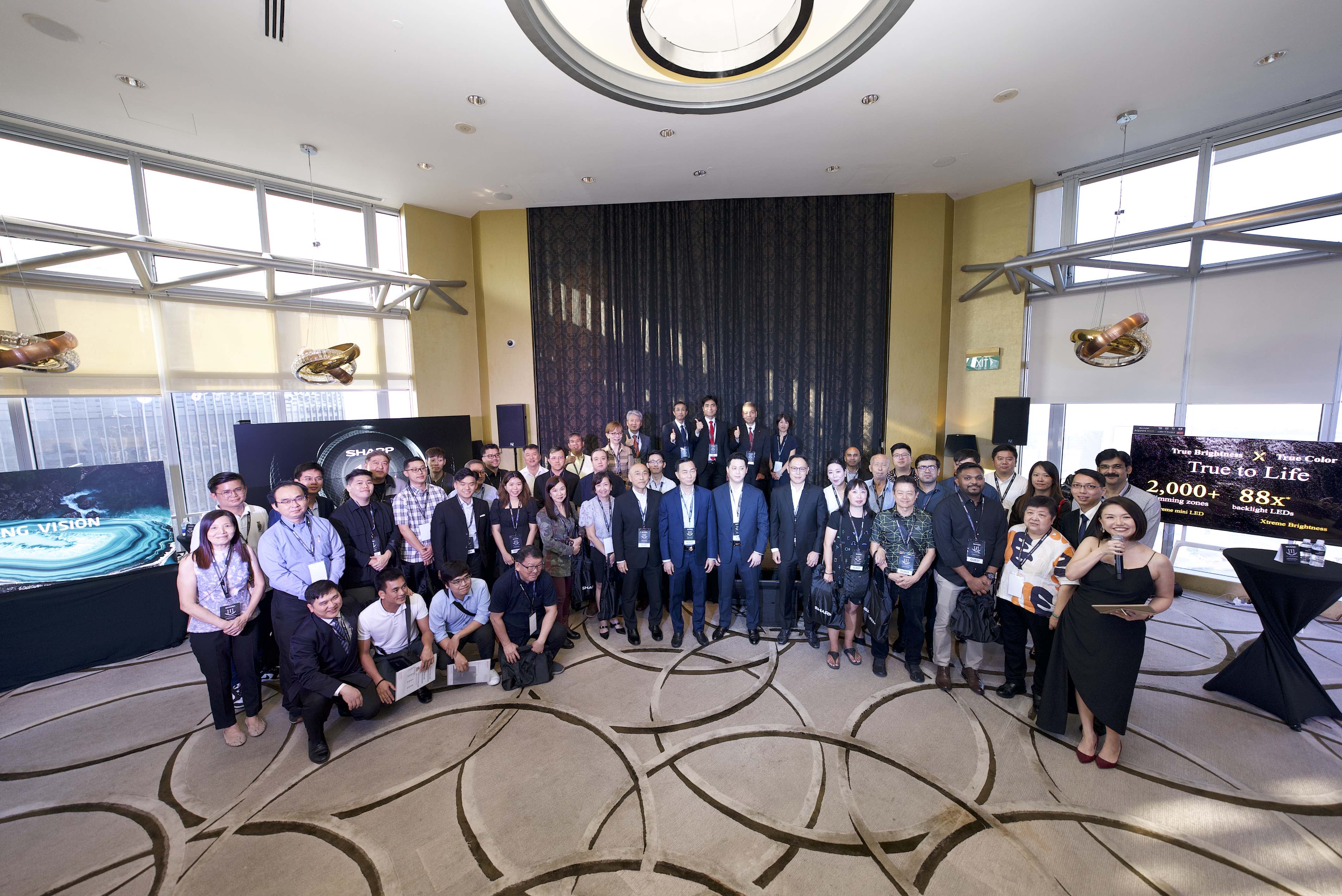 Group photo of management team from SHARP Singapore, distinguished guests from SHARP Japan and attendees at the SHARP 111th-anniversary launch event in Singapore