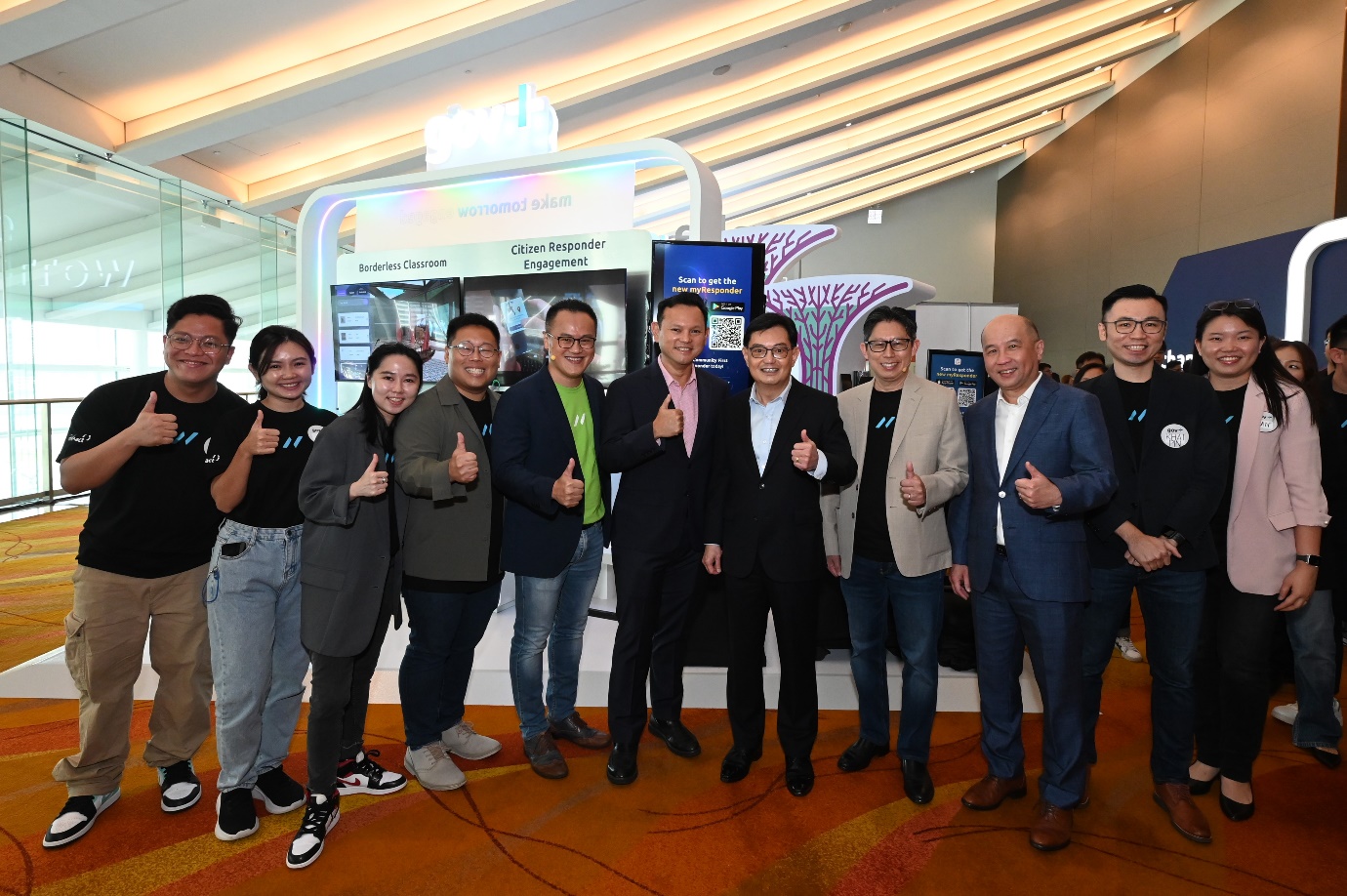 From left to right: Sam Liew, Chief Executive, Gov+, NCS, Senior Minister of State for the Ministry of Manpower, Zaqy Mohamad, Deputy Prime Minister Heng Swee Keat and Ng Kuo Pin, Chief Executive Officer, NCS, at the NCS Impact forum 2024, where a suite of Artificial Intelligence and digital resilience solutions were launched.