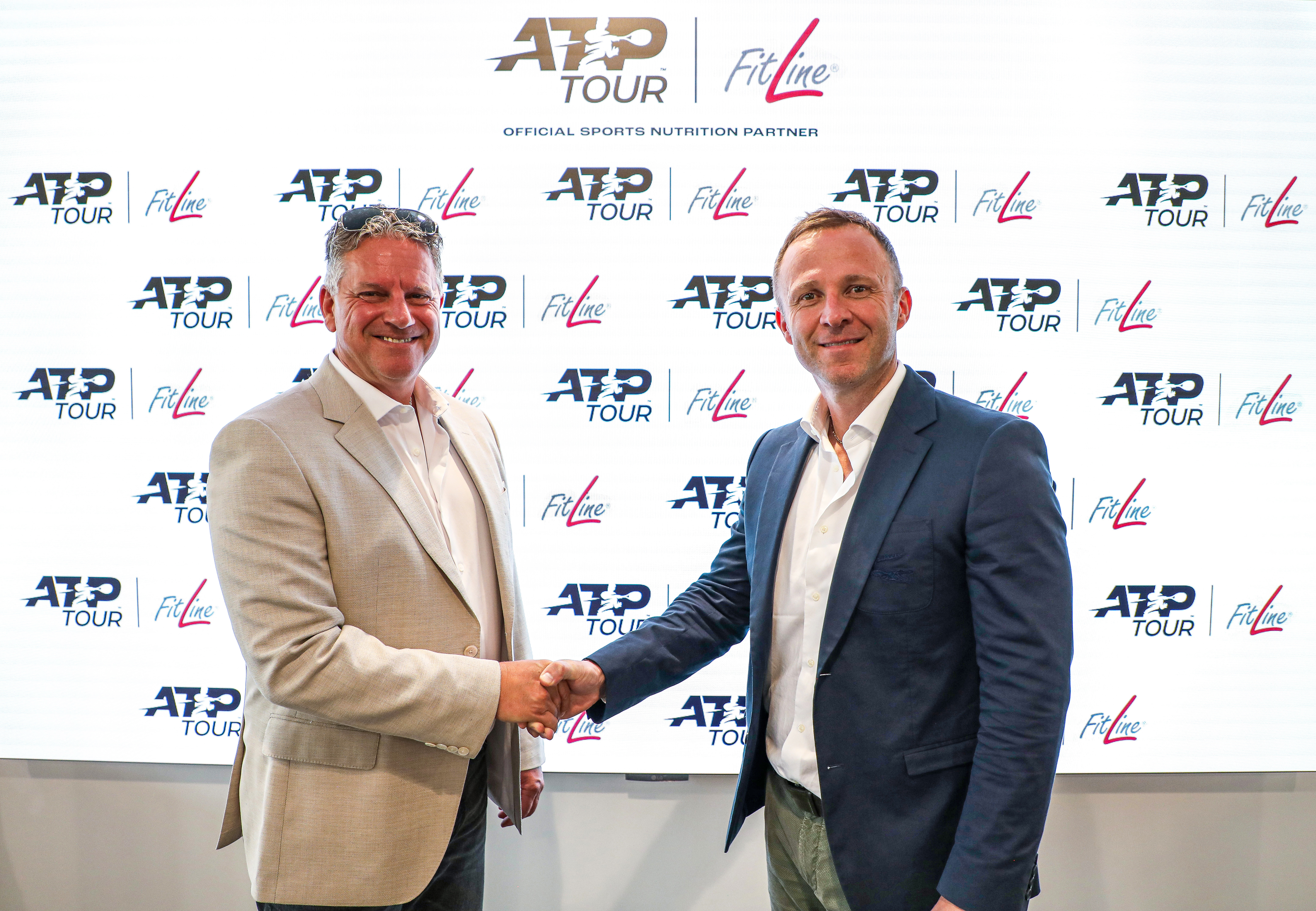 PM-International CEO & Founder Rolf Sorg (left) and ATP CEO Massimo Calvelli (right) during the signing of partnership between ATP and FitLine.